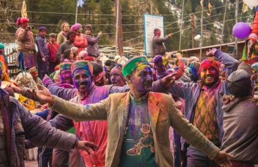 Himachali_people_covered_in_holi_colours,_dancing